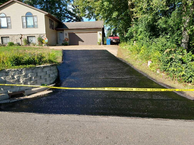 New sealcoating on driveway